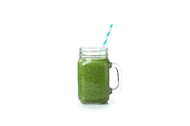 istock Mason jar with green smoothie isolated on white background 1311124305