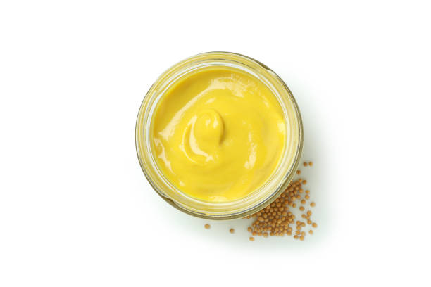 istock Glass jar with mustard isolated on white background 1311125401