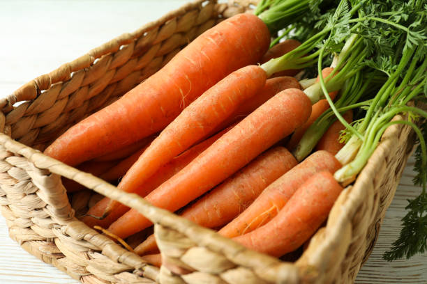 istock Basket with fresh ripe carrot, close up 1311126769