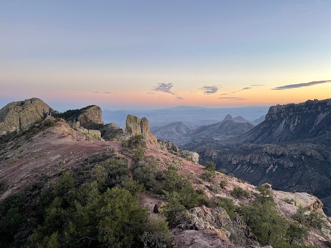 An aerial shot over the mountains of Big Bend National Park in Texas looking towards the US-Mexican border at sunset