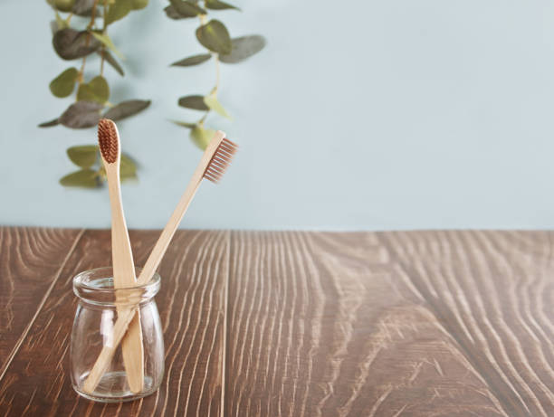 istock Eco-friendly bamboo teeth brushes on the wooden table. Zero waste 1311129701