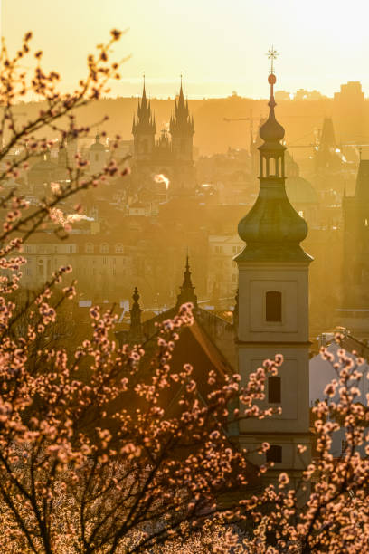 A Prague cityscape in the strong sunrise light.