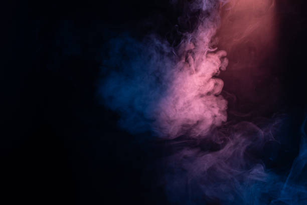 istock Blue and pink steam on a black background. 1311131429