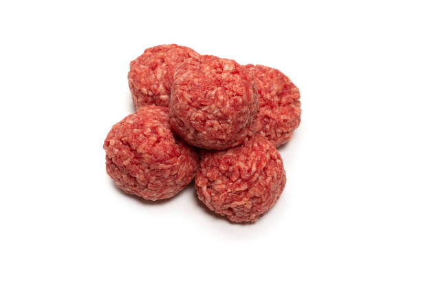 istock Raw meat balls isolated on white background. 1311131444