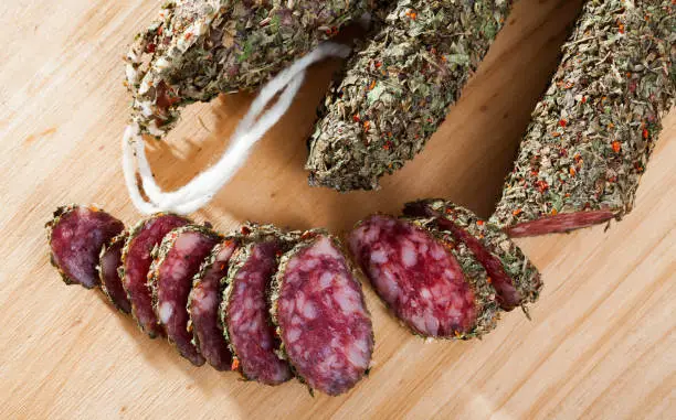 Photo of Fuet sausage coated with herbs
