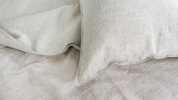 istock Pillows and duvets on the bed with 100% linen bedding. 1311134535
