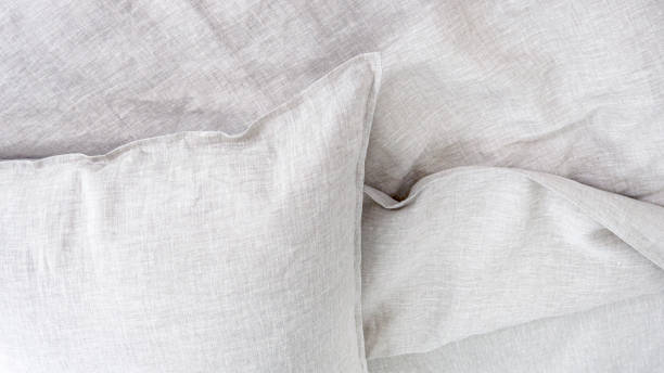 istock Pillows and duvets on the bed with 100% linen bedding. 1311134549