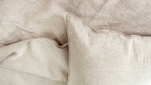istock Pillows and duvets on the bed with 100% linen bedding. 1311134587