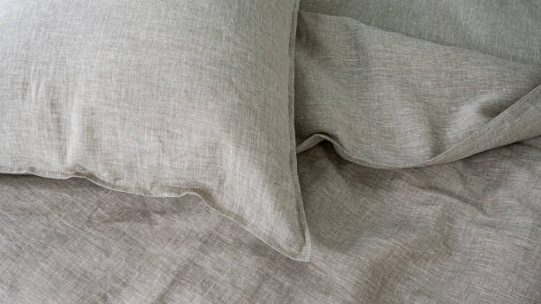 istock Pillows and duvets on the bed with 100% linen bedding. 1311135182