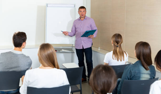 istock Man sharing business ideas with colleagues 1311135212