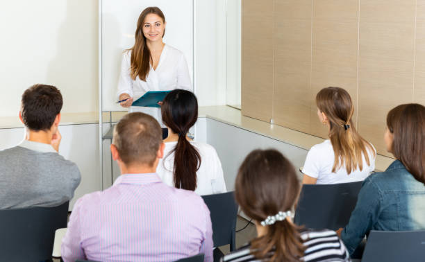 istock Woman presenting business project to partners 1311135218