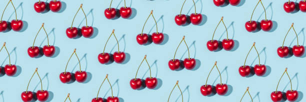 istock A ripe cherry berries on a blue background. 1311136886