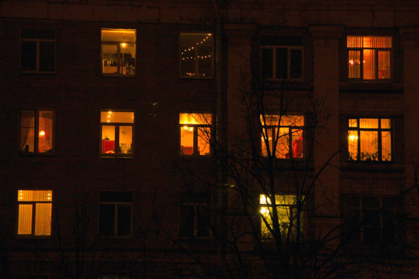 istock light in the windows of houses 1311136981