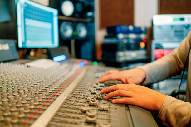 sound engineer working at mixing panel in the recording studio sound engineer working at mixing panel in the recording studio sound technician stock pictures, royalty-free photos & images