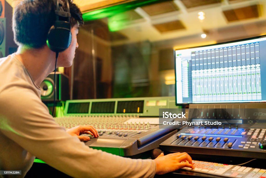 Movie Sound Engineer Sound Engineer Working At Mixing Panel In The Recording Studio Stock ...