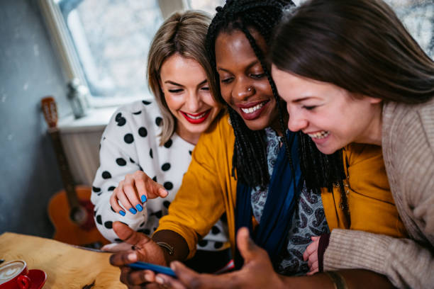 istock Three women checking social media together 1311143698
