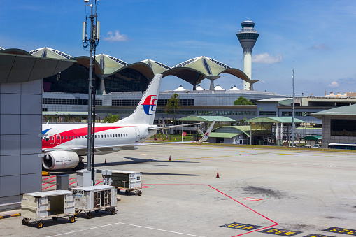 Kuala Lumpur, Malaysia - March 14, 2020: Malaysia Airline planes at departure gate in KLIA international airport located in Sepang near Kuala Lumpur, Malaysia.