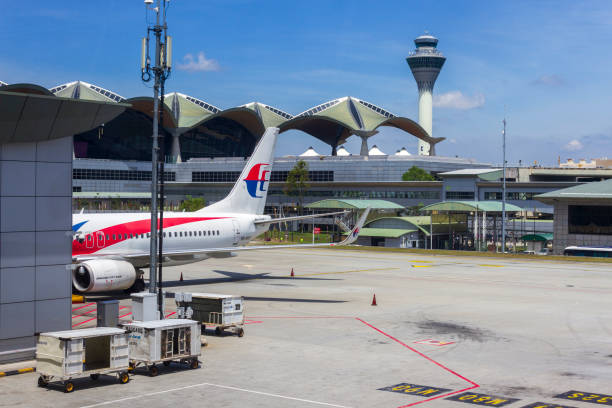 KLIA Malaysia Airline Plane Kuala Lumpur Kuala Lumpur, Malaysia - March 14, 2020: Malaysia Airline planes at departure gate in KLIA international airport located in Sepang near Kuala Lumpur, Malaysia. klia airport stock pictures, royalty-free photos & images