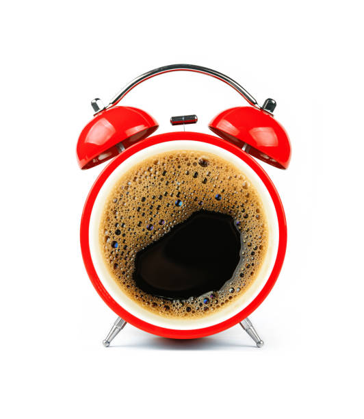 istock Red alarm clock with coffee cup froth face 1311145209