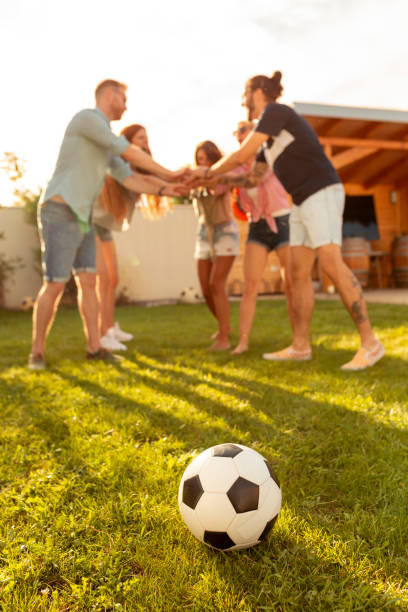 istock Friends gathered in circle during time out while playing football 1311145230