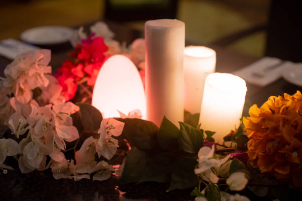 istock slow wide angle shot with flowers and candles and a flickering dome light showing the setting for a romantic lunch dinner date or an event like a wedding or a celebration 1311146145