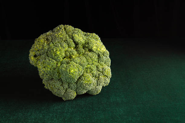 istock fresh broccoli on a green suede background 1311147927