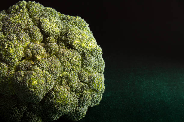 istock fresh broccoli on a green suede background 1311148511