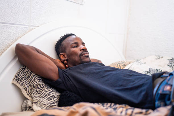 istock Adult man resting in a bedroom 1311149126