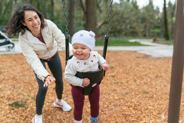 istock Laughing Mixed Race Baby Playing at Park With Her Mom 1311149805