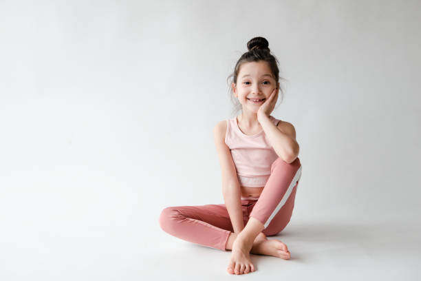 istock Cute Girl Doing Yoga 1311150570