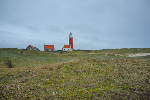 March 2021 Dunes and the lighthouse with the houses on Texel