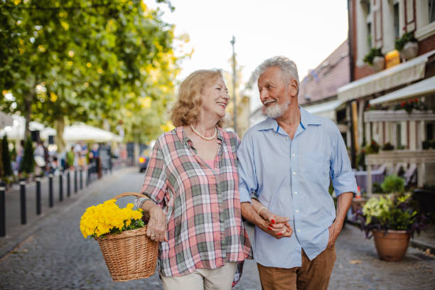 istock Senior couple enjoying walking outside on a nice sunny day 1311157916