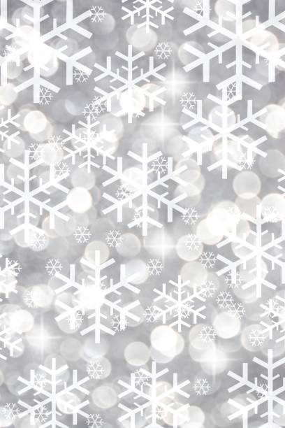 istock Silver bokeh background with snowflakes 1311158584