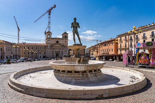 L'Aquila, Italy - Jul 02, 2020: Fountain in the main square of L'Aquila, Italy devasted by earthquake of 2009, Europe