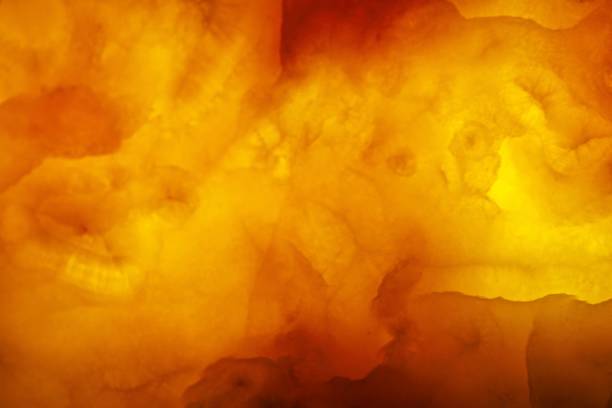istock Surfaceof a yellow onyx marble plate which is illuminated from behind 1311161397