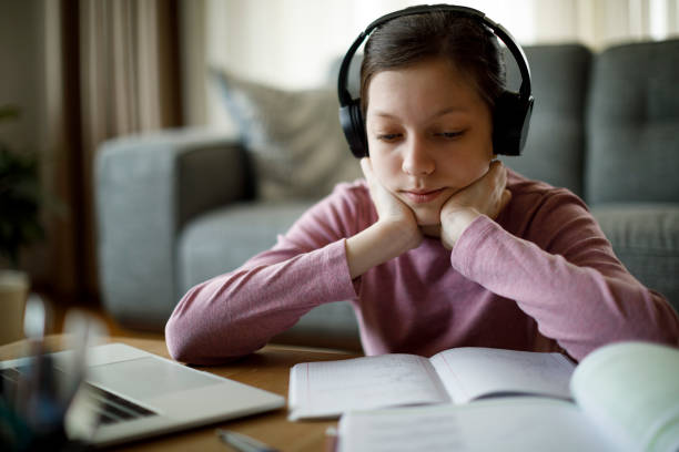 istock Bored female student studying at home 1311162088