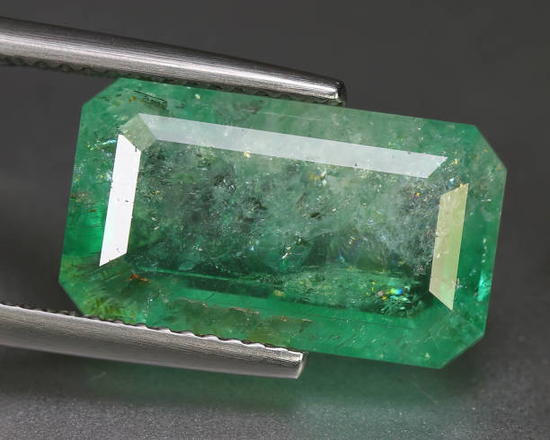 istock Natural gemstone green emerald beryl on background 1311163516