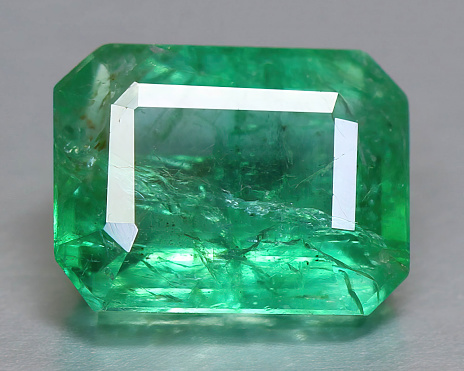 Natural gemstone green emerald beryl on background