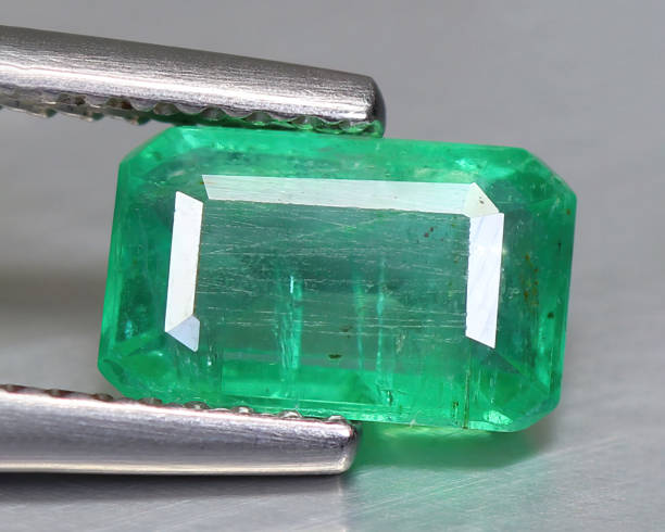 istock Natural gemstone green emerald beryl on background 1311163525