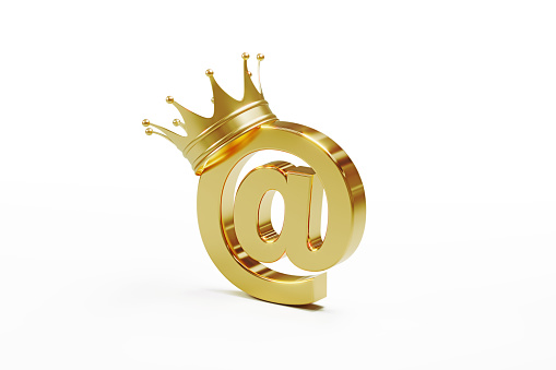 At symbol wearing gold crown isolated on white background. Horizontal composition with clipping path and copy space. E-mail marketing and email campaign concept.