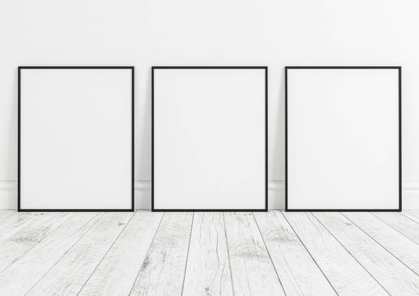 istock Triple 8x10 Vertical Black Frame mockup on white wooden floor and white wall. 1311165665