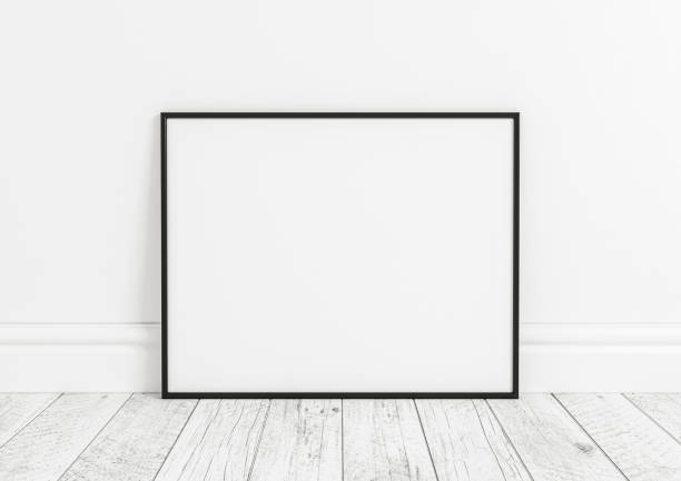 istock Single 8x10 Horizontal Black Frame mockup on white wooden floor and white wall. 1311165684