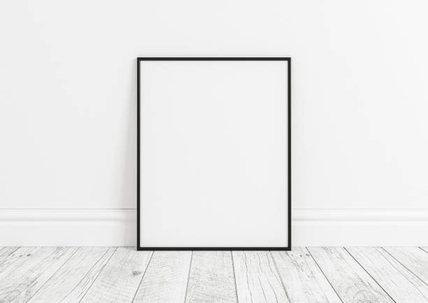 istock Single 8x10 Vertical Black Frame mockup on white wooden floor and white wall. 1311165695