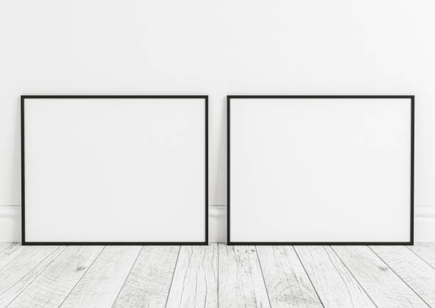 istock Double 8x10 Horizontal Black Frame mockup on white wooden floor and white wall. 1311165703