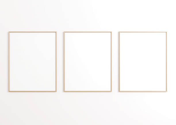 istock Triple 8x10 Vertical Beige Frame mockup on white wall. 1311165855