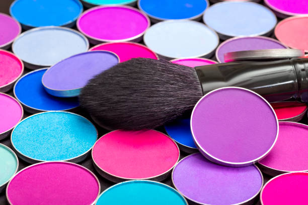 istock Cosmetic makeup eye shadow set.  Bright and colorful background. 1311166017