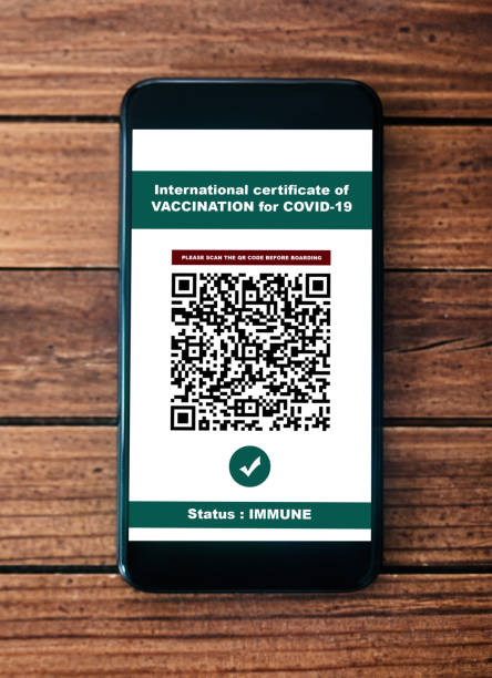 istock certificate of vaccination on the smartphone 1311166068