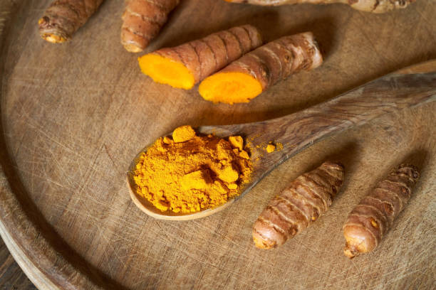 istock Fresh turmeric root and ground turmeric powder 1311166670