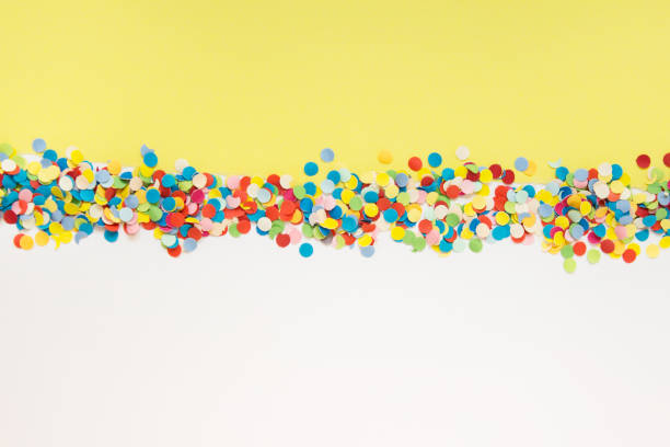 istock Double colored paper with confetti and copy blank space 1311167813