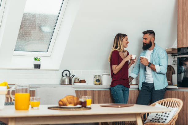istock Couple drinking coffee at home 1311167887